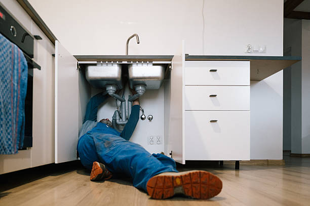 Professional Emergency Plumber technician working in Etowah, NC